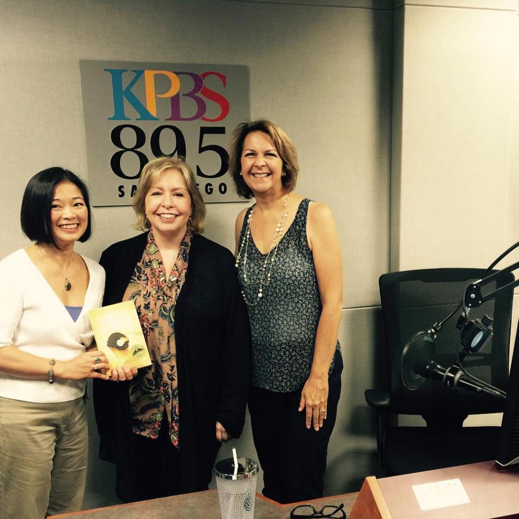Midday Edition's Host Maureen Cavanaugh flanked by me and Susan McBeth of Adventures by the Book, after our interview